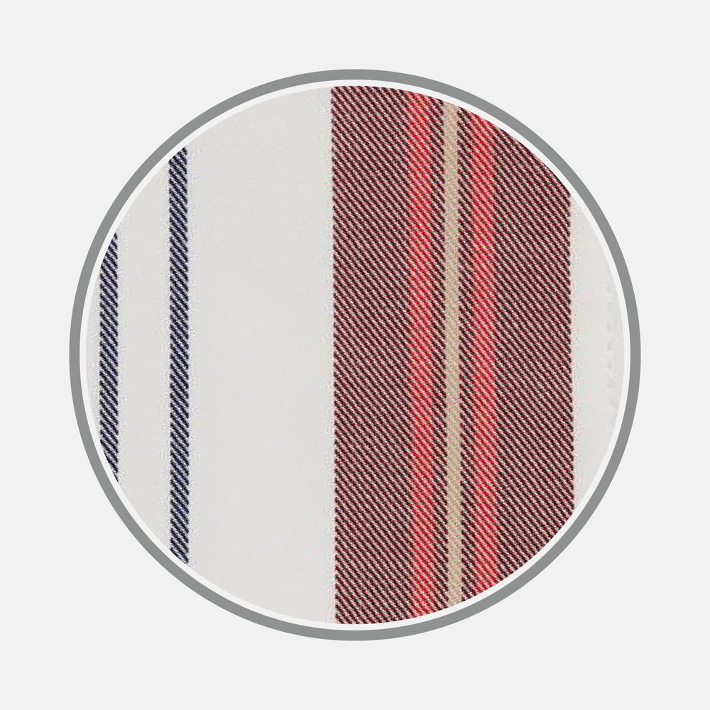 A close-up of Turnbull & Asser’s Red, Blue & White Stripe Cotton Fabric is displayed within a circular frame on a light gray background, showcasing its diagonal white, navy blue, red, and beige stripes.