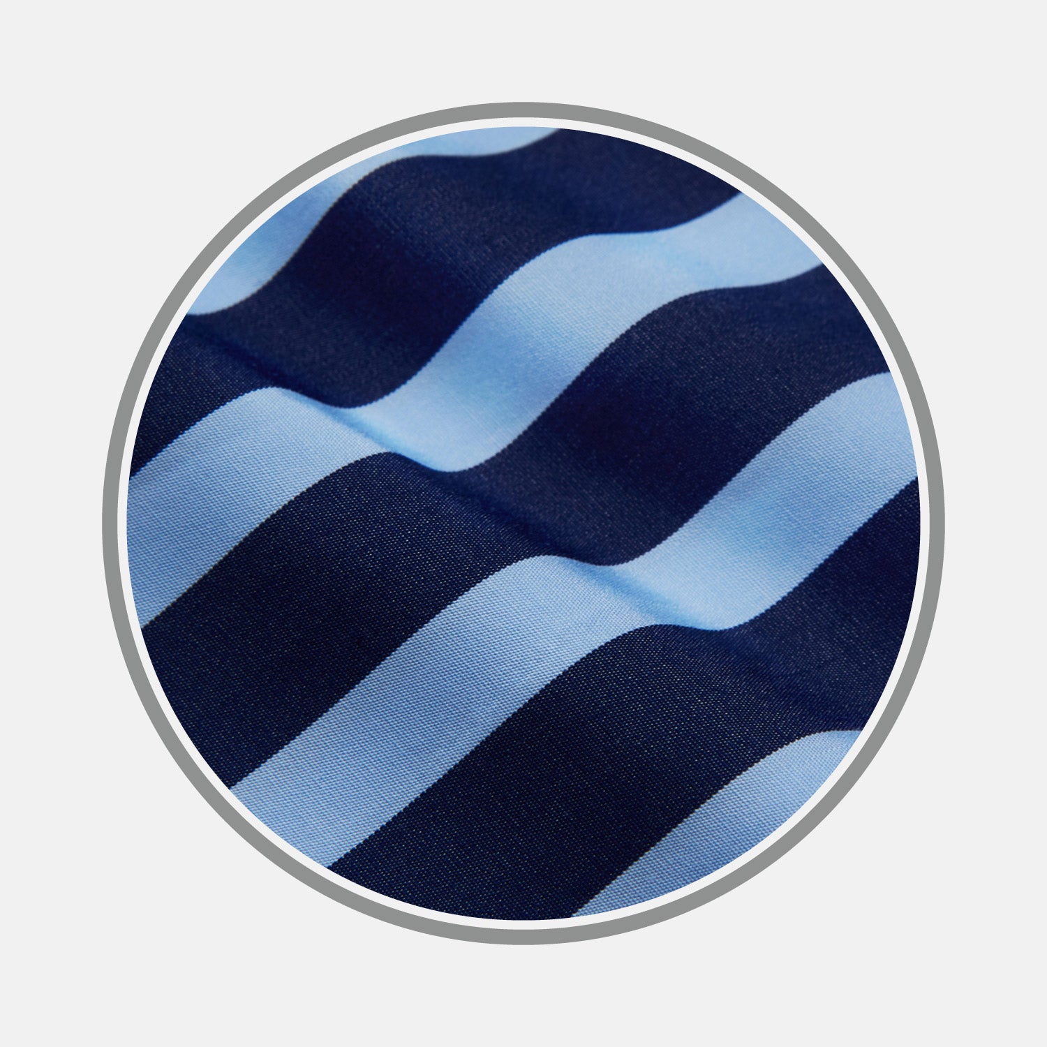 View 1 of product Close-up of Turnbull & Asser’s Navy Wide Stripe Cotton Fabric, showing textured, slightly wavy horizontal stripes in light and dark blue through a circular frame.