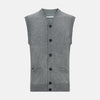 View 1 of product The Turnbull & Asser Ash Grey V-neck Sleeveless Cardigan features a button-up front, two front pockets, and ribbed edges, shown against a plain white background.