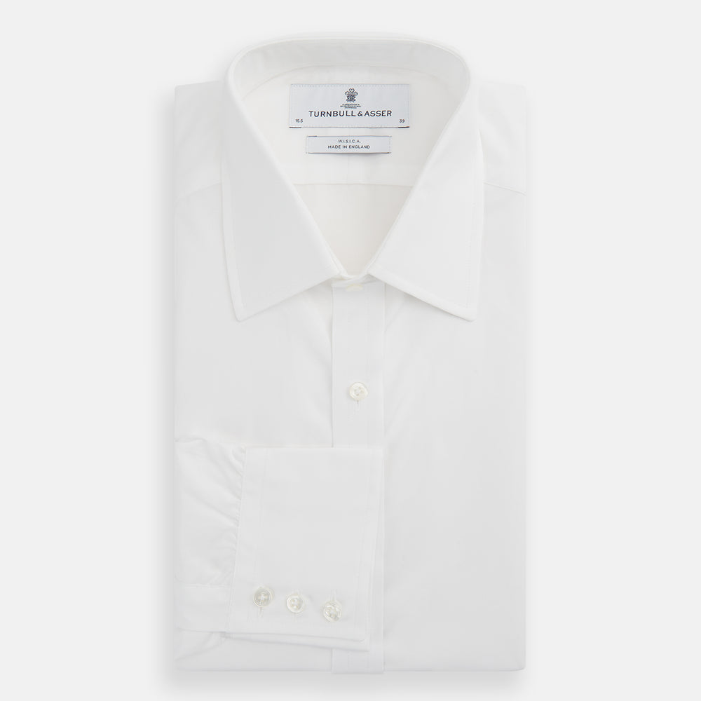 The Turnbull & Asser White West Indian Sea Island Cotton Shirt features a T&A collar, 3-button cuffs, and is crafted from luxurious long-staple cotton for exceptional softness. Displayed against a white background.