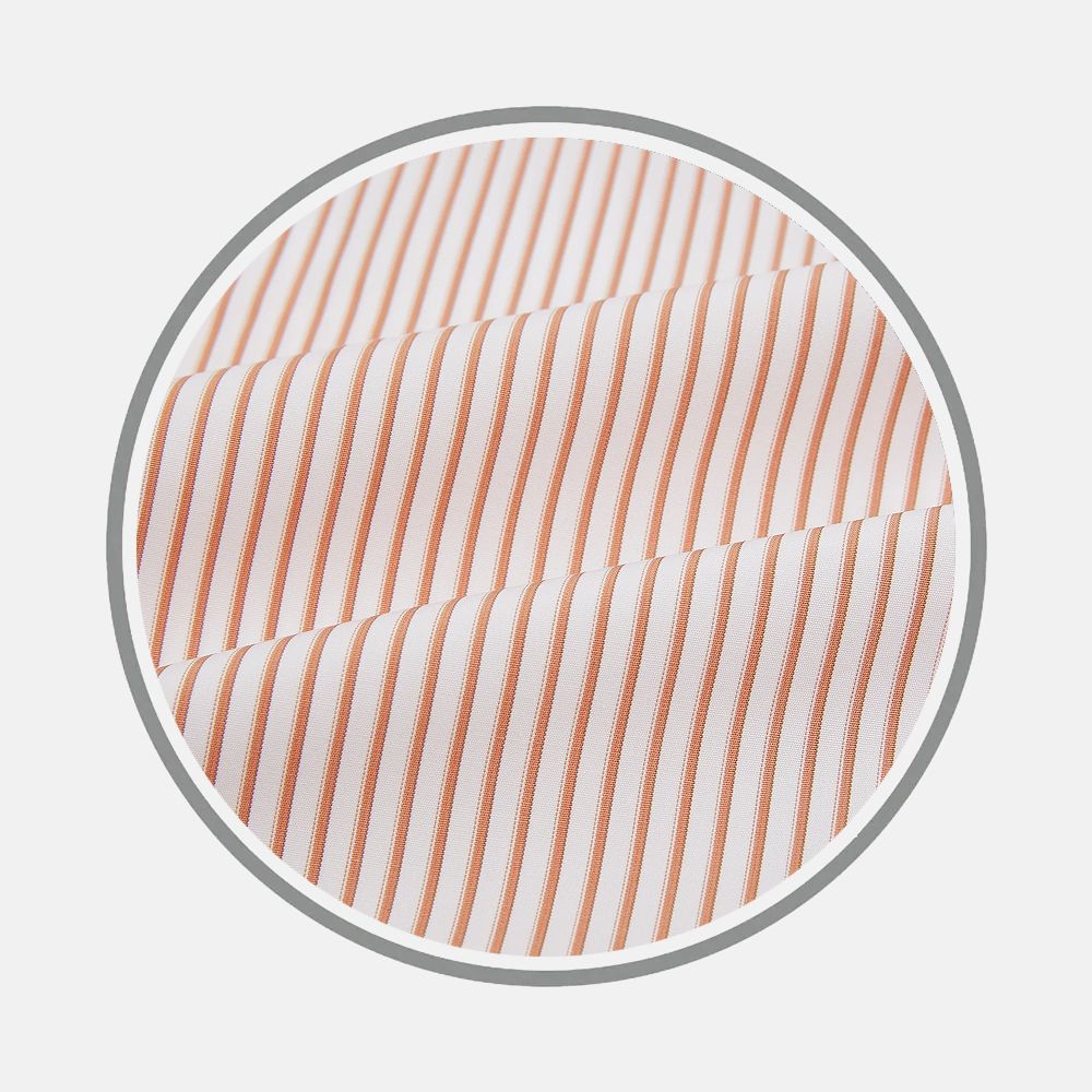 Close-up of Turnbull & Asser's Orange Multi Stripe Fabric shows white fabric with thin, evenly spaced orange vertical stripes, displayed in a circular frame on a light gray background.