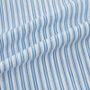 View 6 of product The Turnbull & Asser Sky Blue Double Stripe Mayfair Shirt features sky blue and white vertical stripes, a T&A collar, buttoned cuffs, and is displayed flat on a white background.
