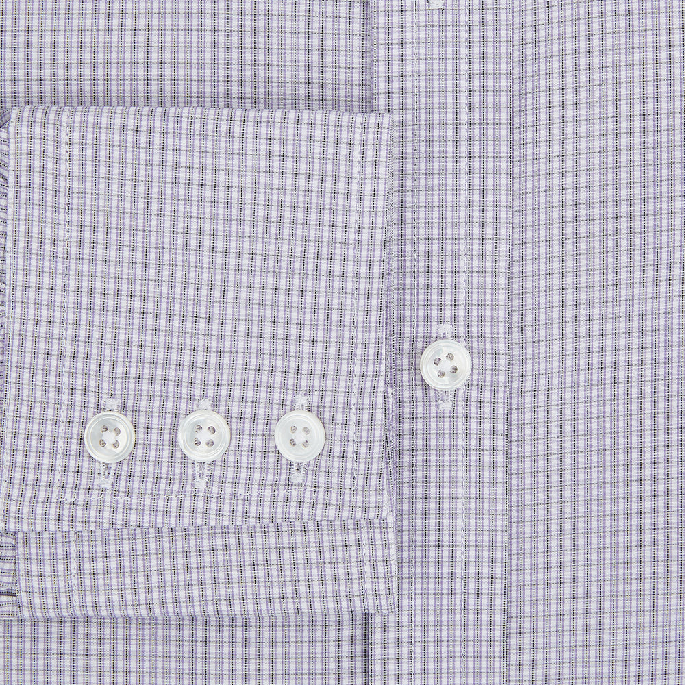 The Turnbull & Asser Purple Micro Check Mayfair Shirt features long sleeves, button-up front, pointed collar, and buttoned cuffs in a subtle lilac and white check, exemplifying British craftsmanship and displayed on a white background.