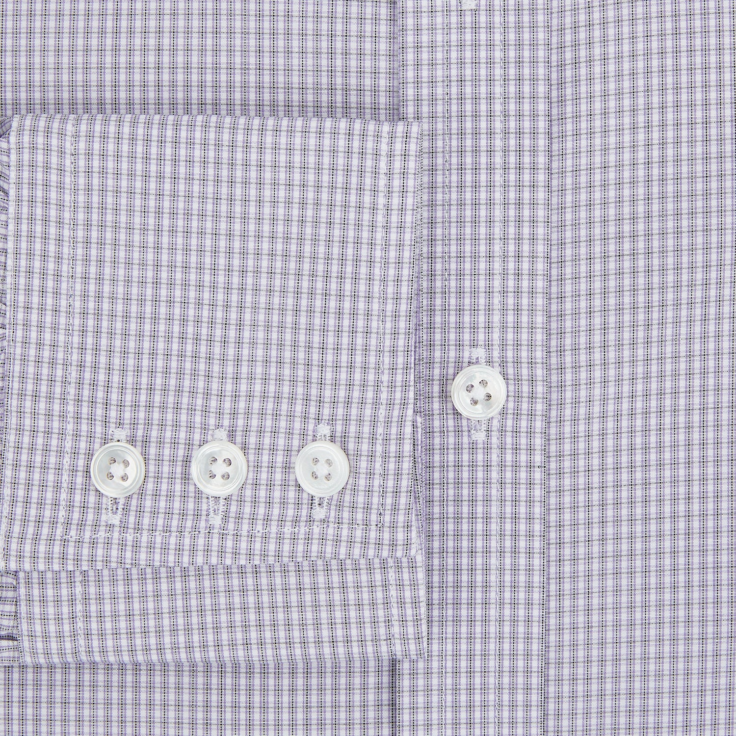 View 4 of product The Turnbull & Asser Purple Micro Check Mayfair Shirt features long sleeves, button-up front, pointed collar, and buttoned cuffs in a subtle lilac and white check, exemplifying British craftsmanship and displayed on a white background.