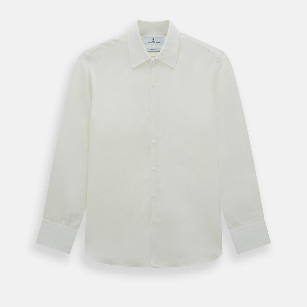 The Vanilla Linen Westminster Shirt by Turnbull & Asser is a long-sleeve, white button-up with a Turnbull collar, buttoned cuffs, and straight hem, highlighting British craftsmanship against a plain white background.
