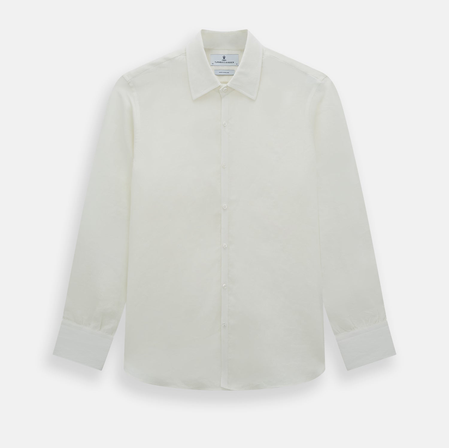 View 1 of product The Vanilla Linen Westminster Shirt by Turnbull & Asser is a long-sleeve, white button-up with a Turnbull collar, buttoned cuffs, and straight hem, highlighting British craftsmanship against a plain white background.