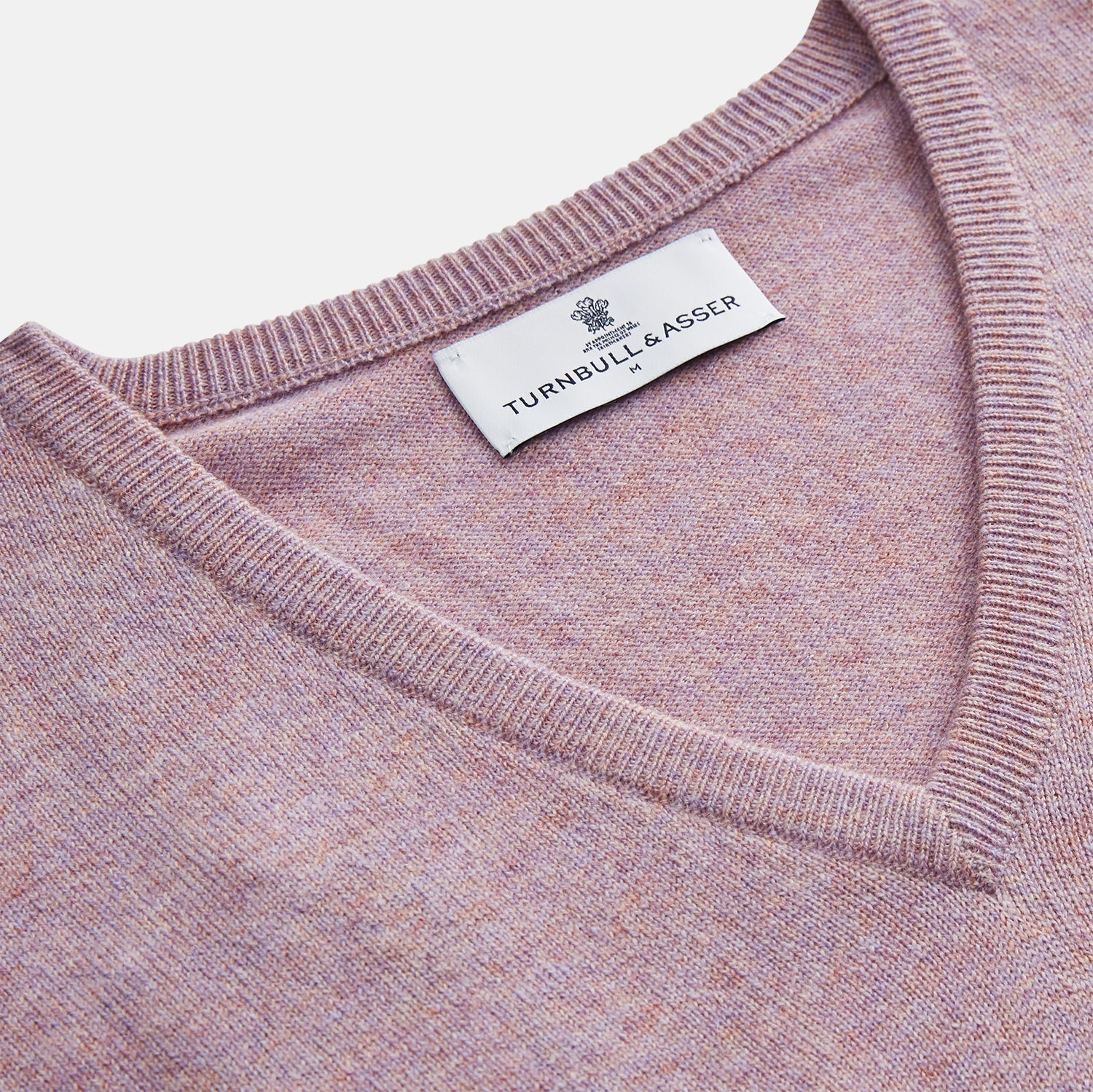 View 2 of product The Turnbull & Asser Lilac Heather Ifor Cashmere Slipover is a sleeveless, V-neck knit vest in soft cashmere, shown flat against a white background.
