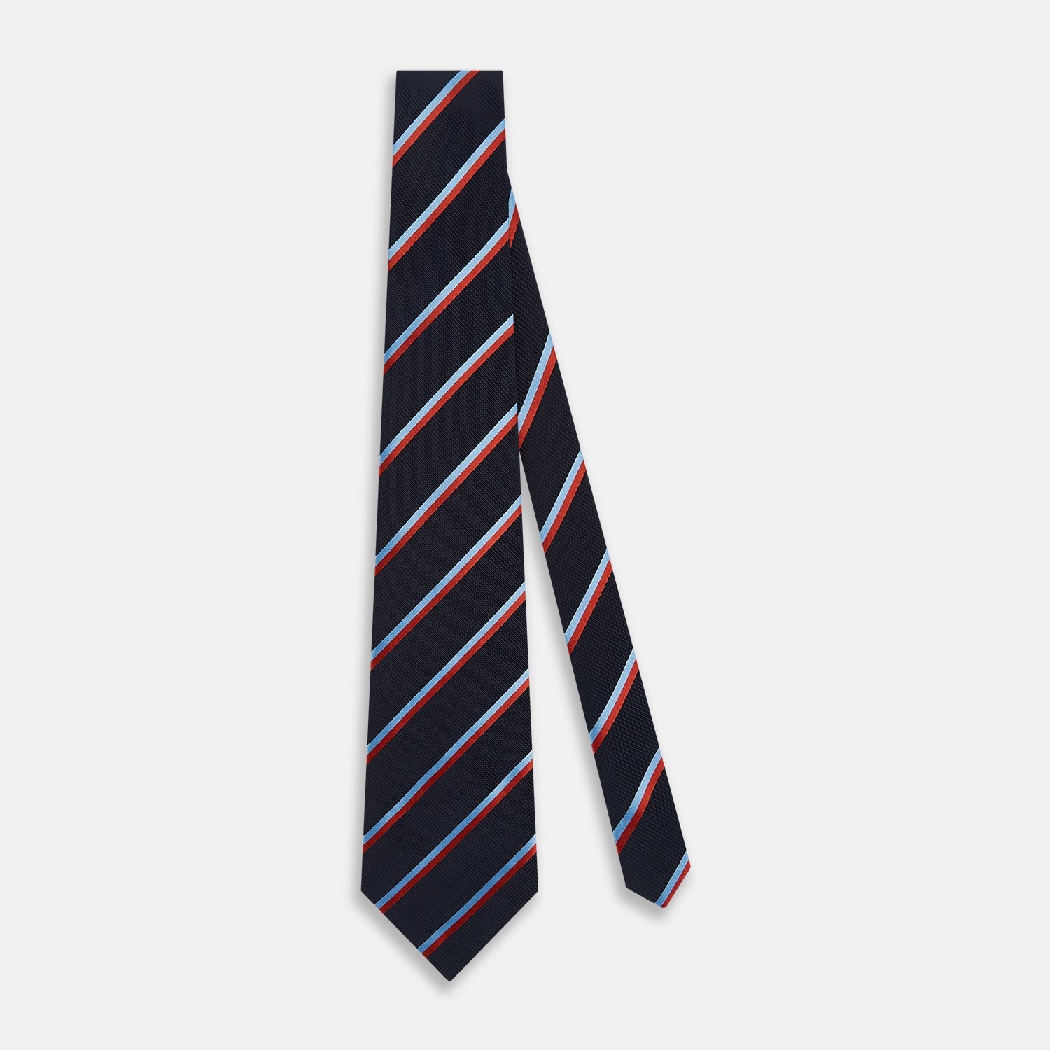 View 2 of product The Turnbull & Asser Red And Blue Stripe Silk Blend Tie, rolled on a white background, features refined diagonal accents—an elegant formal accessory.
