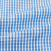 View 6 of product The Turnbull & Asser Blue Multi Micro Check Mayfair Shirt features a classic T&A collar, button-up front, white buttons, cuffed long sleeves, and a refined light blue and white micro check pattern.