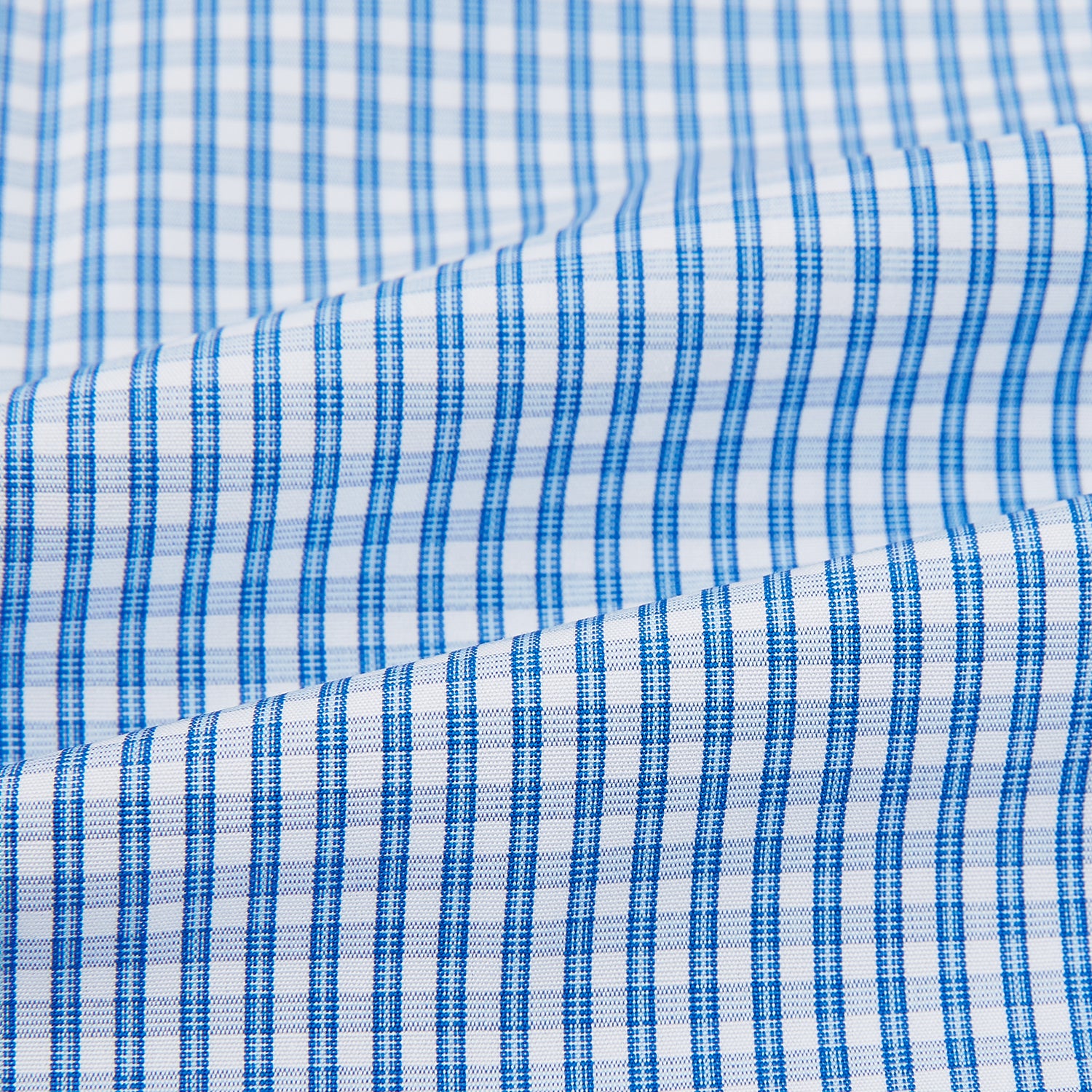 View 6 of product The Turnbull & Asser Blue Multi Micro Check Mayfair Shirt features a classic T&A collar, button-up front, white buttons, cuffed long sleeves, and a refined light blue and white micro check pattern.