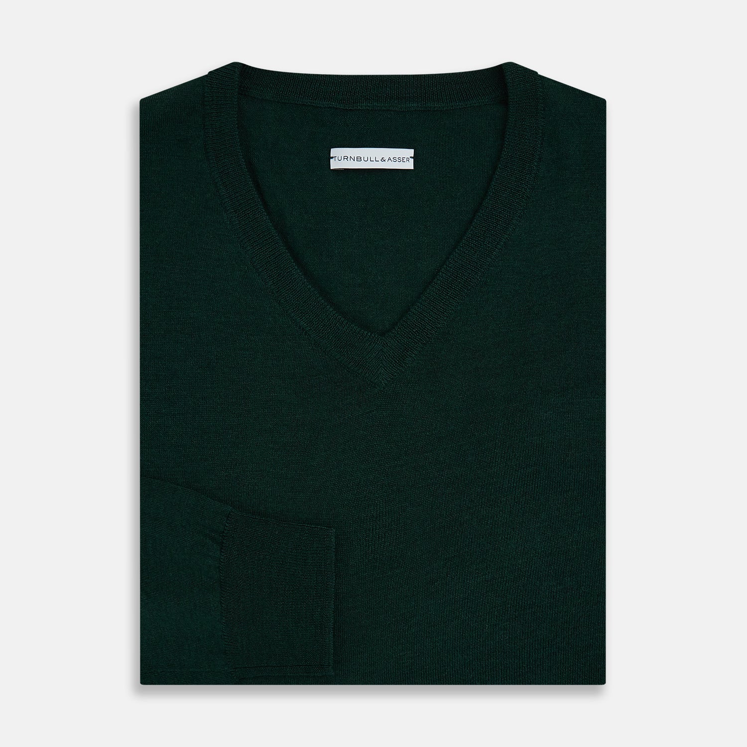 View 4 of product The Turnbull & Asser Forest Green Fine Merino V-Neck Jumper features long sleeves, ribbed cuffs and hem—classic knitwear for any wardrobe, shown on a white background.