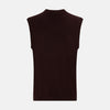 View 3 of product The Turnbull & Asser Burgundy Fine Merino V-Neck Vest is a sleeveless knitwear piece with ribbed trim at the neck, armholes, and hem, shown against a plain white background.