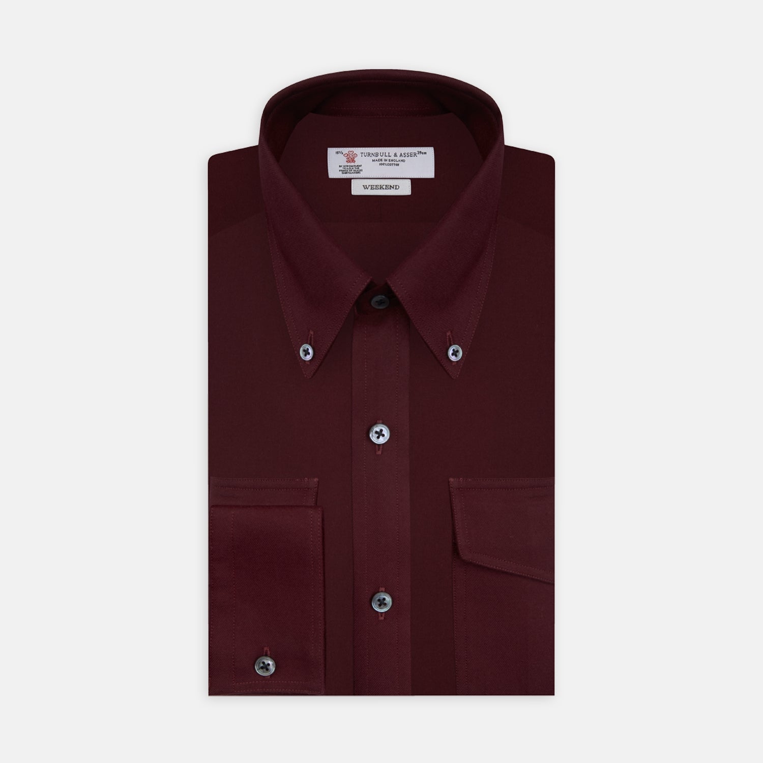 View 1 of product The Turnbull & Asser Burgundy Cashmerello Button Down Shirt features long sleeves, buttoned chest pockets, a spread collar, and is crafted from a soft cotton-cashmere blend, neatly displayed on a plain white background.