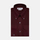 The Turnbull & Asser Burgundy Cashmerello Button Down Shirt features long sleeves, buttoned chest pockets, a spread collar, and is crafted from a soft cotton-cashmere blend, neatly displayed on a plain white background.