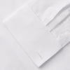 View 9 of product A woman with straight brown hair pulled back wears the Turnbull & Asser White Cotton Marlene Shirt, featuring classic menswear details, paired with high-waisted cream trousers against a neutral background.