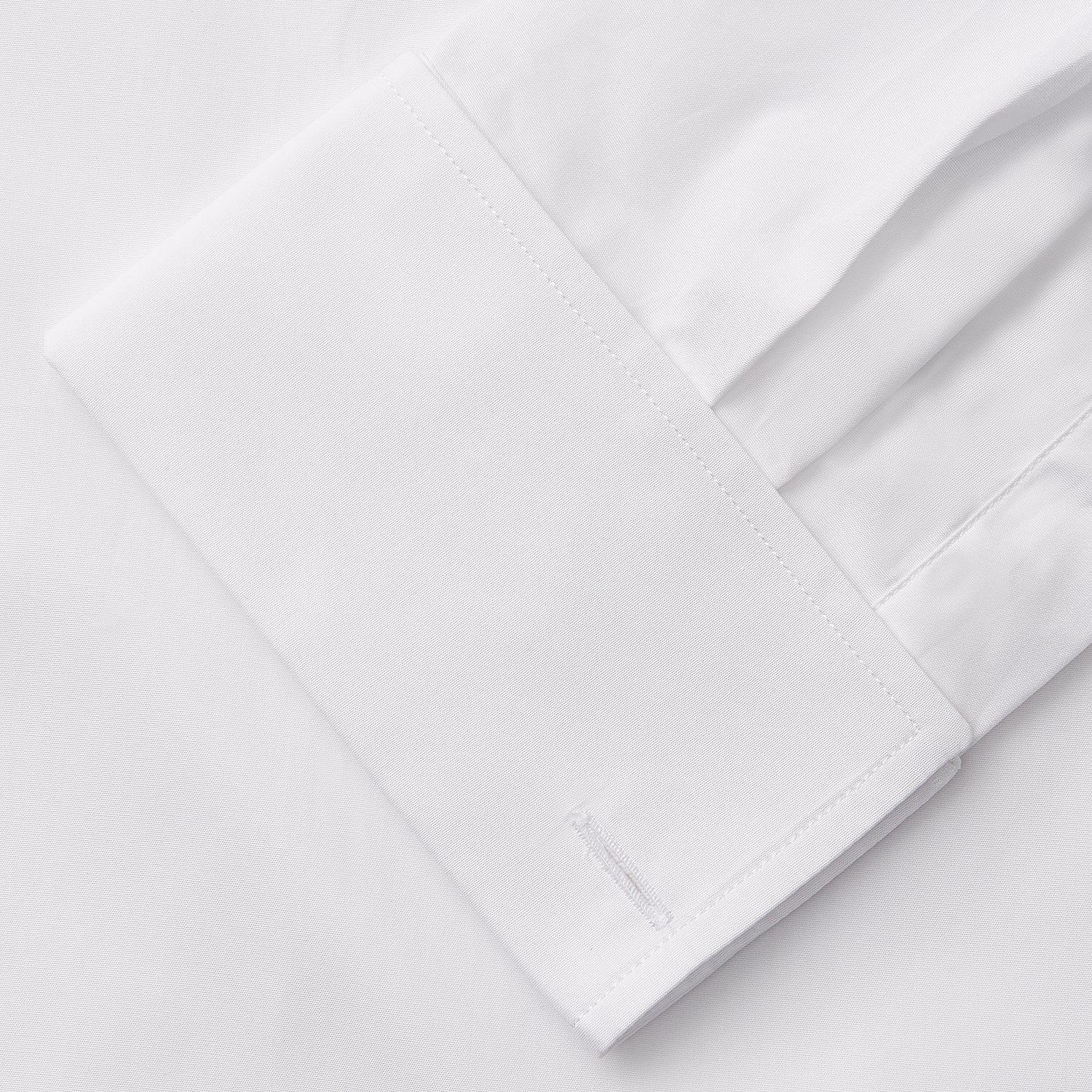View 9 of product A woman with straight brown hair pulled back wears the Turnbull & Asser White Cotton Marlene Shirt, featuring classic menswear details, paired with high-waisted cream trousers against a neutral background.