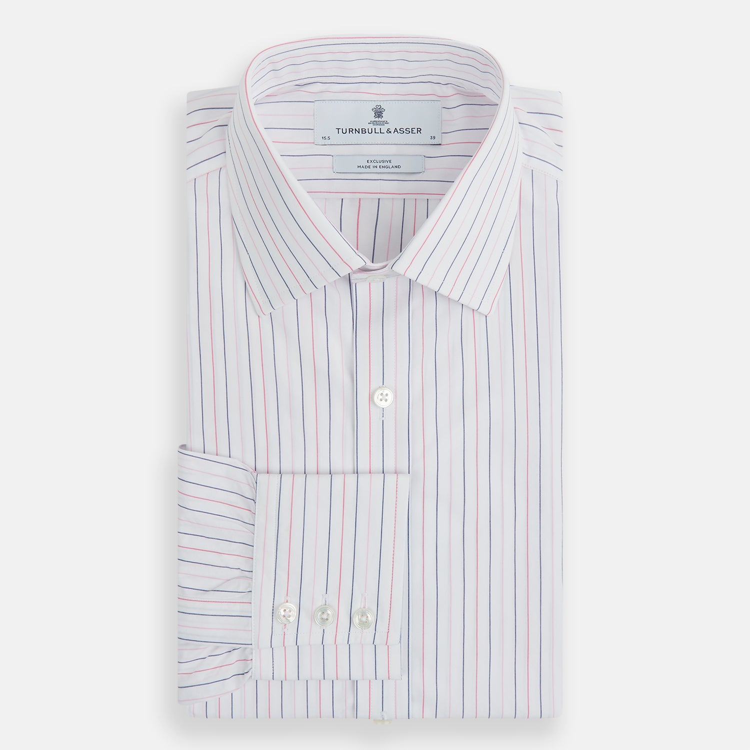 View 12 of product The Turnbull & Asser Pink and Blue Wide Pinstripe Mayfair Shirt features long sleeves, T&A collar, button-down front, and buttoned cuffs. It has bold pink and blue pinstripes on white and is laid flat on a white surface.