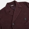 View 2 of product The Burgundy Kingston Corduroy Caban Jacket by Turnbull & Asser features black buttons, a notched collar, and front pockets. Crafted from premium cotton, it is shown on a plain white background.