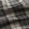 View 4 of product The Brown Multi Check Linen Weekend Fit Unwin Shirt by Turnbull & Asser features a beige, brown, and black plaid pattern, stand collar, button-up front, long sleeves, and two buttoned chest pockets.