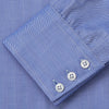 View 3 of product Turnbull & Asser's Blue Herringbone Tailored Fit Shirt with a Kent collar and white buttons is shown laid flat on a white background.