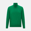 View 1 of product The Turnbull & Asser Hunter Green Fine Merino High Neck Jumper features a classic long-sleeve turtleneck style, crafted from soft merino wool and displayed against a crisp white background.