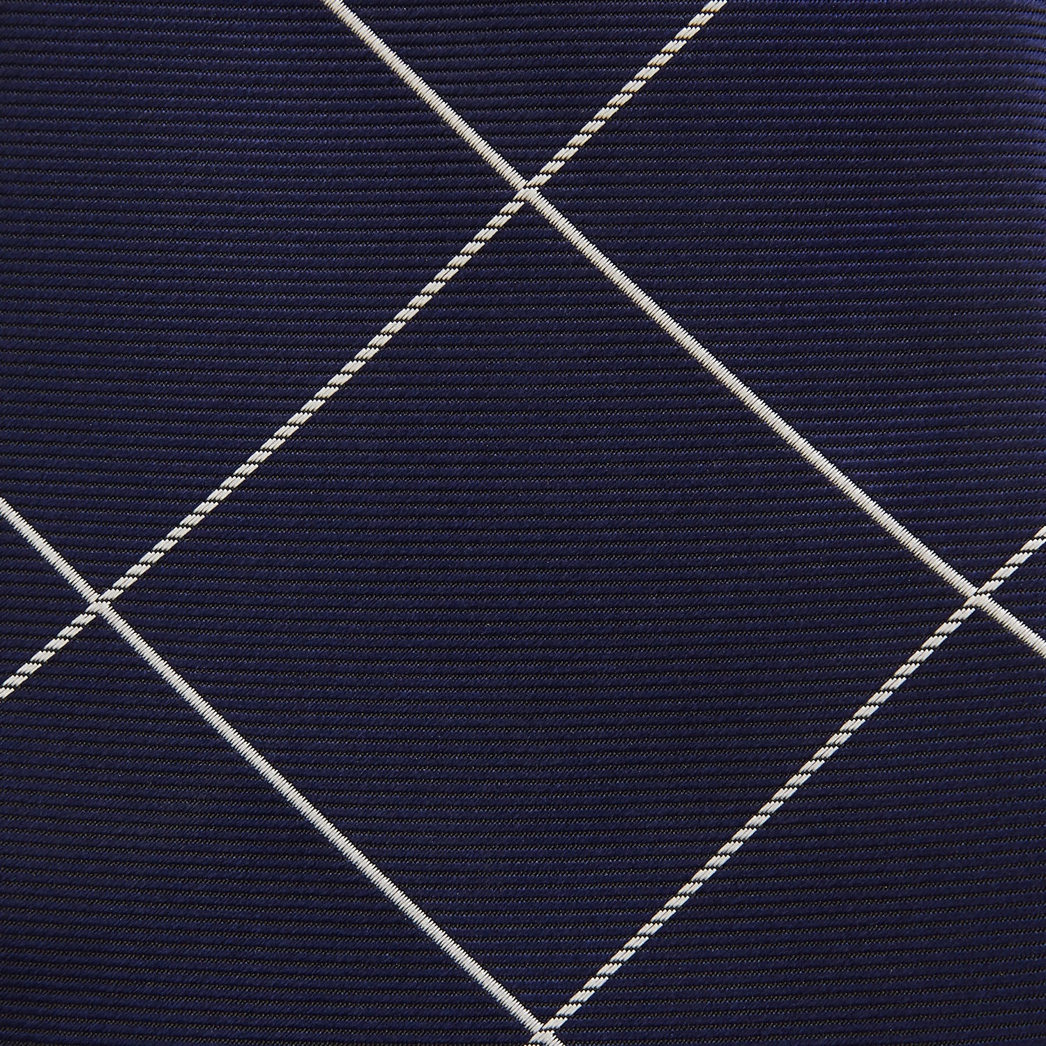 View 3 of product The Turnbull & Asser WINDOW PANE NAVY WHITE TIE features navy blue silk with a subtle diagonal ribbed texture and white windowpane checks, making it the perfect men’s accessory for any formal occasion.