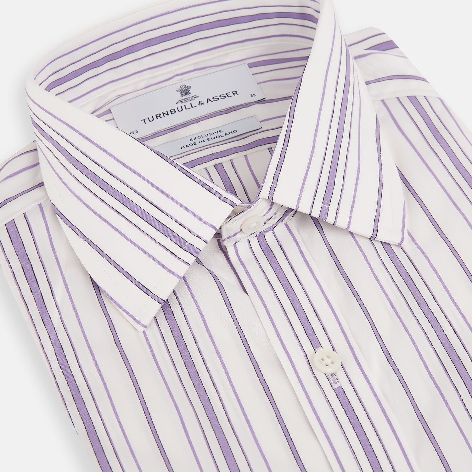 View 2 of product The Purple Multi Stripe Mayfair Shirt by Turnbull & Asser is a long-sleeve, collared button-up featuring vertical blue and purple stripes on white, ideal for formal occasions. The shirt is neatly displayed flat against a white background.