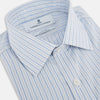View 2 of product The Turnbull & Asser Blue Graph Check Mayfair Shirt features a classic T&A collar, Mayfair fit, buttoned cuffs, and long sleeves with light blue graph checks on a white background.