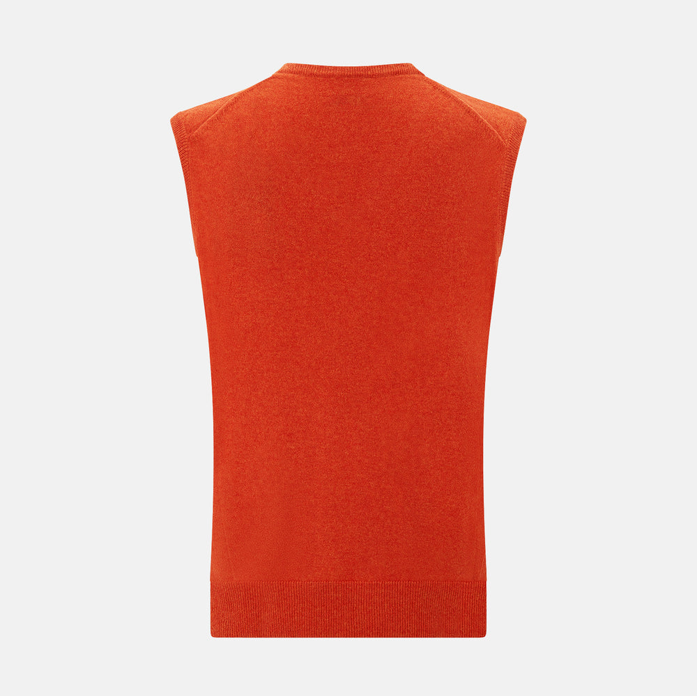 The Turnbull & Asser Red Orange Cashmere Sleeveless Vest with a V-neck, ribbed hem, and minimalist design is showcased against a white background—ideal for the refined gentleman.