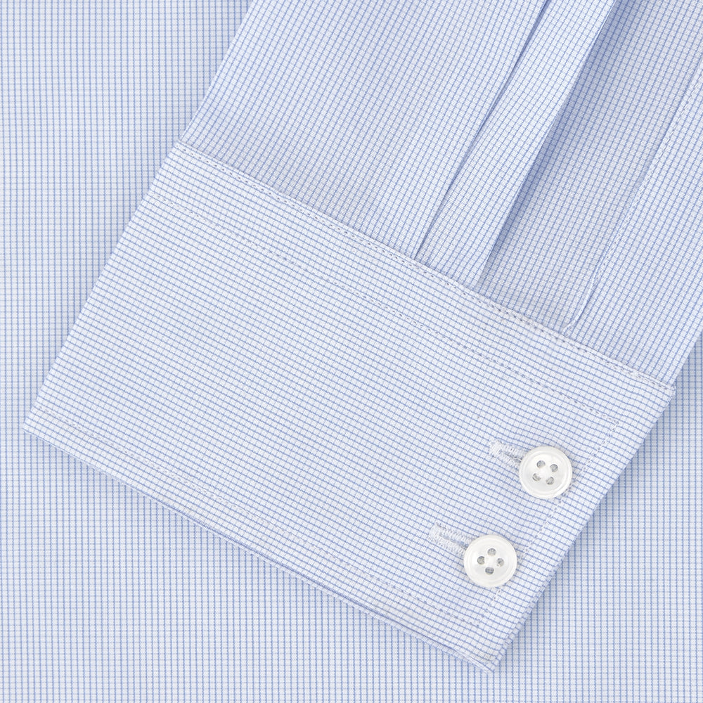 A Tailored Fit Blue Fine Bengal Stripe Shirt with a Kent Collar and 2-button cuffs by Turnbull & Asser, neatly folded and displayed against a plain white background.
