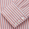 View 3 of product The Turnbull & Asser Orange and White Stripe Cotton Regular Fit Mayfair Shirt features vertical stripes, a classic collar, and buttoned cuffs—an essential men’s wardrobe piece, shown laid flat on a white background.