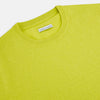 View 2 of product The Turnbull & Asser Lemon Green Cashmere Round Neck Jumper features long sleeves with ribbed cuffs and hem, displayed on a white background.