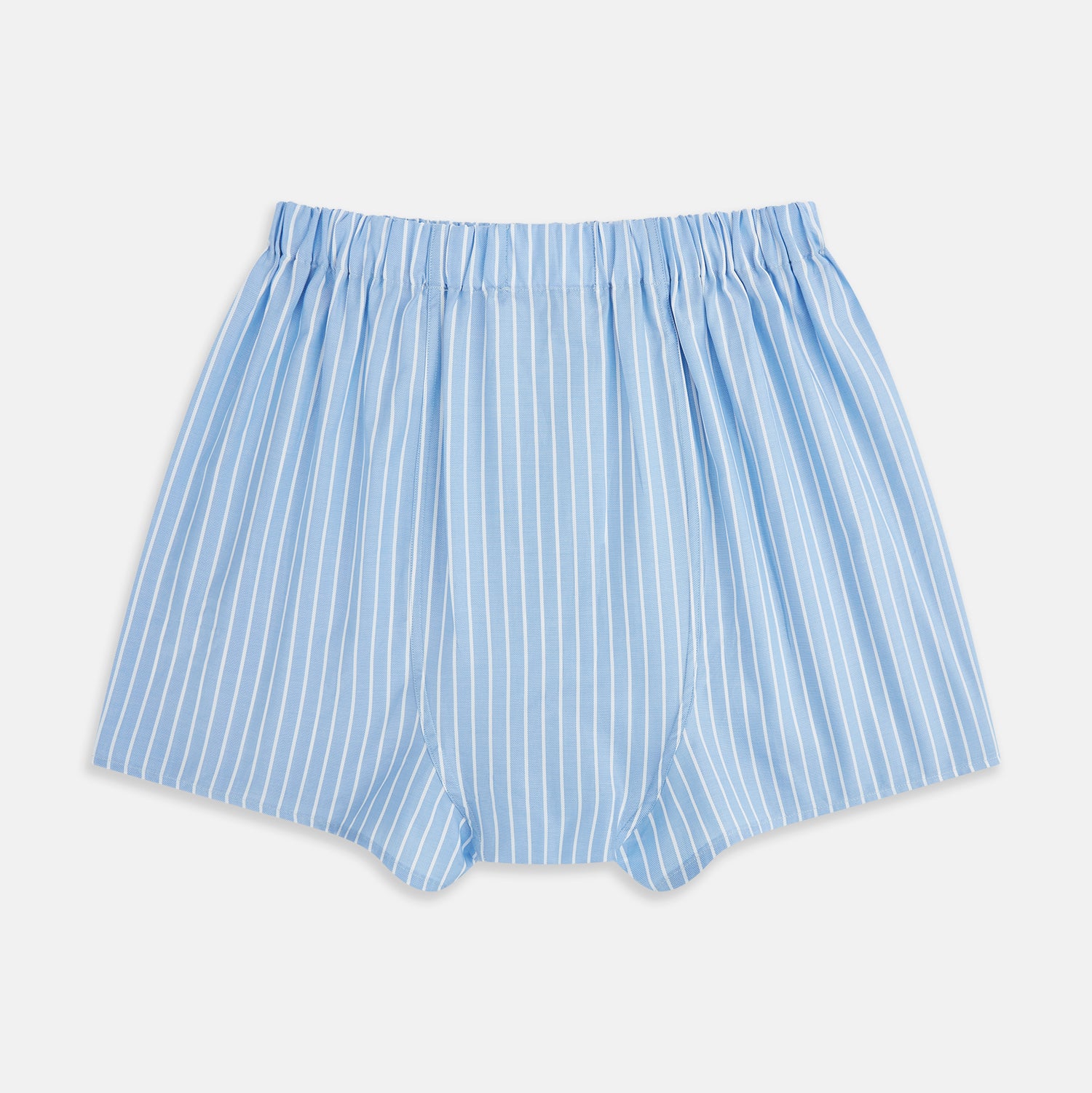 View 2 of product Turnbull & Asser White and Blue Stripe Godfrey Boxer Shorts, crafted from premium Italian cotton with vertical white pinstripes, an elastic waistband, and a loose fit, are shown laid flat on a white background.