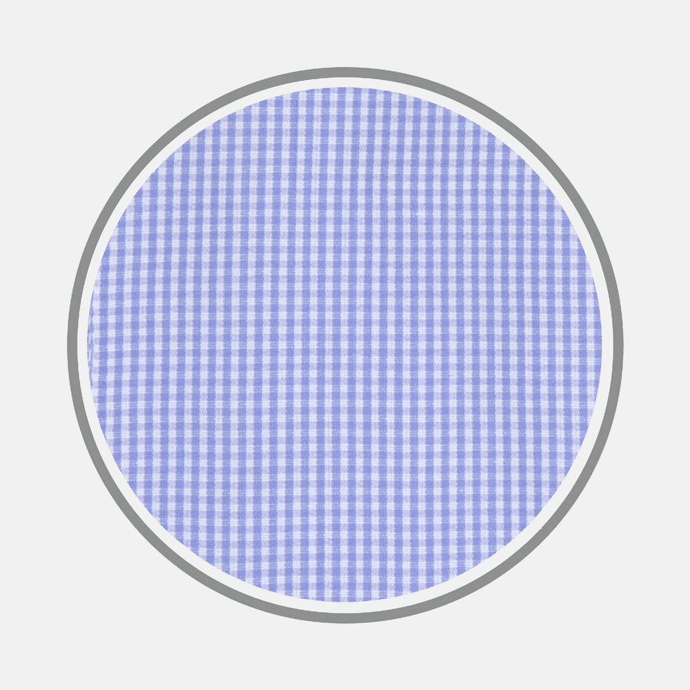 A close-up of Turnbull & Asser's Blue Fine Check Sea Island Quality Cotton Fabric, featuring a small light blue and white checkered pattern, shown as a circular swatch on a white background with a gray border.