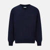 View 1 of product The Turnbull & Asser Navy Fine Merino V-Neck Jumper is displayed against a white background, featuring ribbed cuffs and hem for timeless style in a classic, plain long-sleeve design.