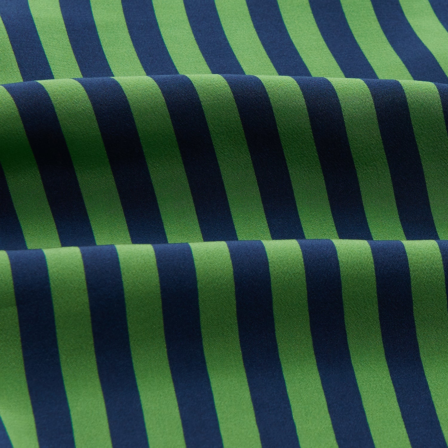 View 4 of product The Turnbull & Asser Green and Navy Candy Stripe Silk Weekend Fit Harold Shirt features long sleeves, a button-up front, collar, and cuffs, displayed laid flat on a white background.