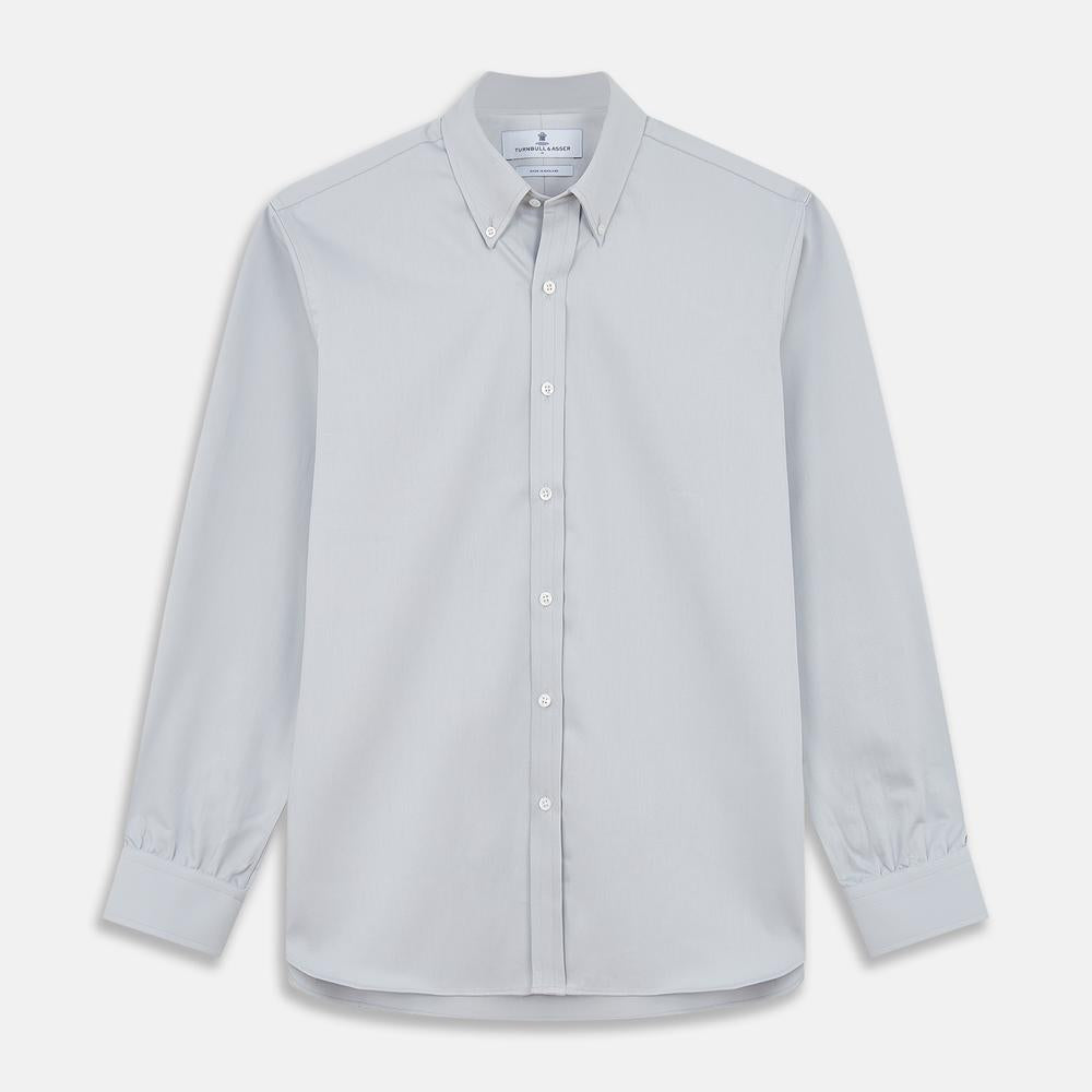 A close-up of Turnbull & Asser's Plain Grey Cotton Fabric shows its textured surface with diagonal lines and soft shadows, presented inside a circular frame on a white background.