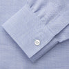 View 4 of product The Turnbull & Asser Pale Blue Weekend Fit Hayne Shirt features a Dorset collar, white buttons, and 1-button cuffs. This casual, long-sleeve button-down is displayed laid flat on a white background.