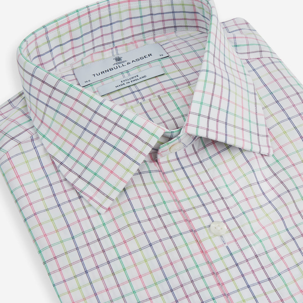 The Turnbull & Asser Multicoloured Double Grid Check Mayfair Shirt, made from organic cotton, features long sleeves, a collar, and a blue, green, and red grid check on white. The shirt is shown neatly laid flat against a white background.