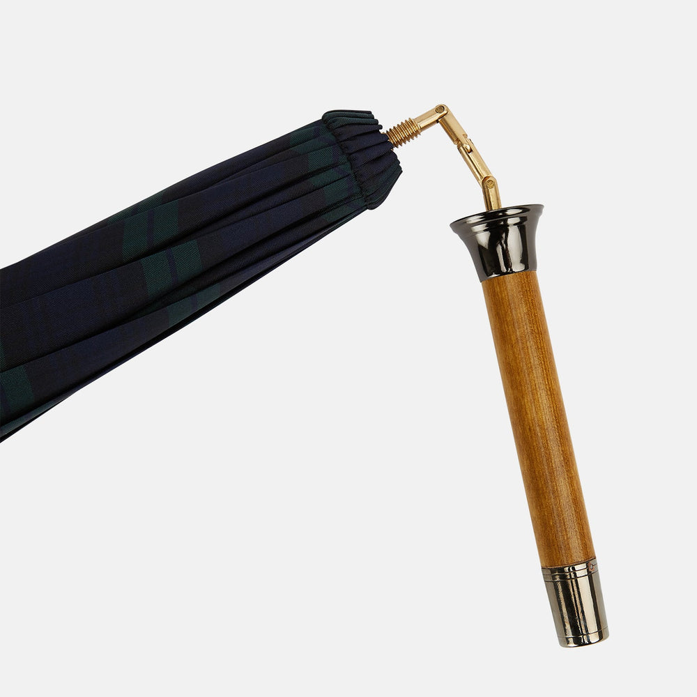 The Turnbull & Asser Black Watch Tartan Traveller Umbrella features a Malacca crook handle and a dark green and navy blue plaid canopy, shown against a plain white background.