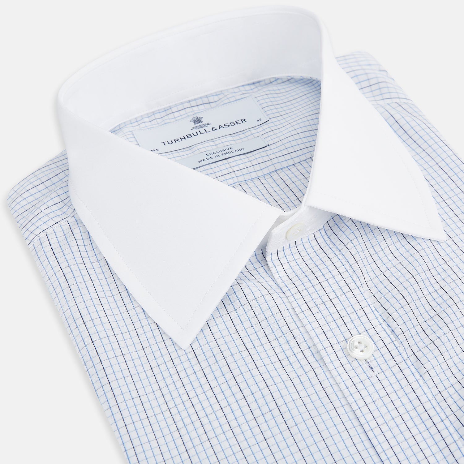 View 2 of product The Turnbull & Asser Pale Blue and Navy Grid Check Shirt features a contrast T&A collar and cuffs, long sleeves, and a button-down front, all displayed on a plain white background.