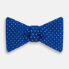 View 1 of product The Turnbull & Asser Electric Blue and White Spot Silk Bow Tie features evenly spaced white polka dots on vibrant silk, shown against a plain white background.