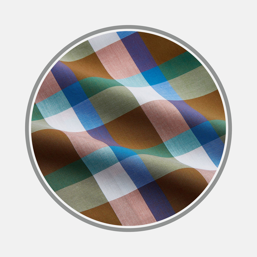 A close-up of Turnbull & Asser's Green and Pink Multi-check Cotton Blend Fabric, shown in a circular frame to highlight its vibrant multicolored check pattern and textured weave.