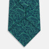 View 3 of product The Turnbull & Asser Kelly Green Paisley Silk Tie is shown rolled on a plain white background, featuring an intricate paisley pattern in rich green tones.