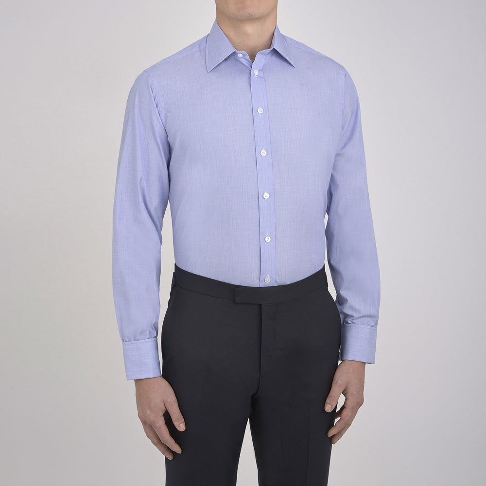 The Turnbull & Asser Blue End-on-End Cotton Shirt features a T&A collar, double cuffs, and white buttons—ideal for smart looks or pairing with a navy suit. Displayed against a plain white background.