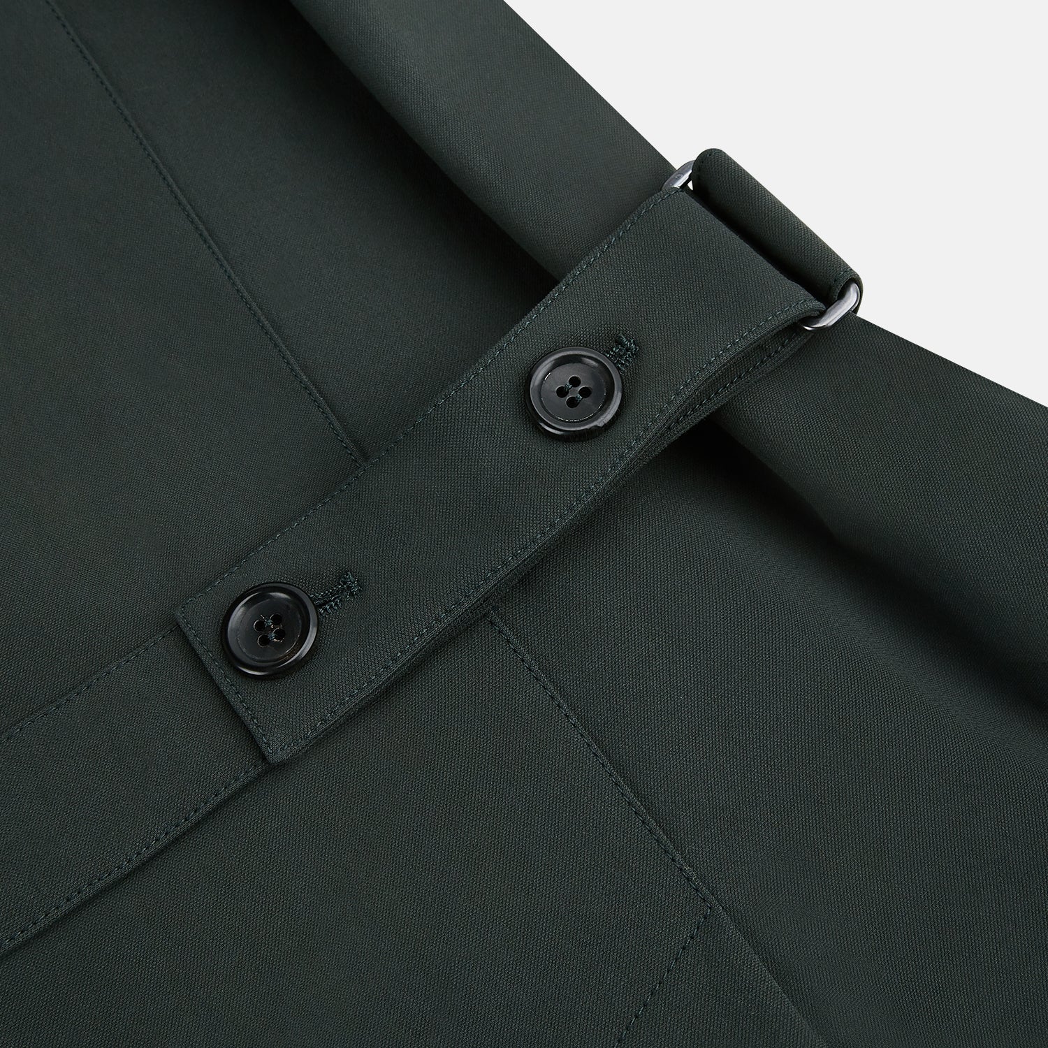 View 5 of product A Forest Green John Arthur Trench Coat by Turnbull & Asser, knee-length with a single-breasted button closure, three zippered pockets, and buttoned cuffs, is laid flat on a white background.