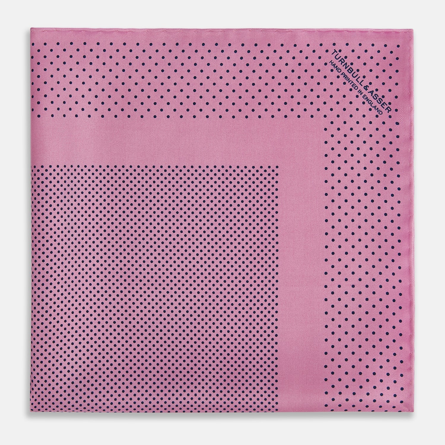 View 3 of product The Pink Dot Silk Pocket Square by Turnbull & Asser features pink silk with a border of small black dots, expertly handcrafted for a stylish touch to any suit. Fold to showcase both sides for added elegance.