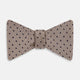 The Turnbull & Asser Navy and Taupe Micro Dot Silk Bow Tie features a grid pattern with small dots, shown against a plain white background.