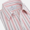 View 2 of product The Red Multi Pencil Stripe Windsor Shirt by Turnbull & Asser features long sleeves, buttoned cuffs, a Turnbull collar, and classic British tailoring with vertical red, pink, and white stripes.