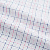View 6 of product The Turnbull & Asser Pink Overlay Grid Check Mayfair Shirt is a long-sleeved, button-up with a collar and buttoned cuffs, featuring a white base and thin pink grid lines. Laid flat against a white surface.
